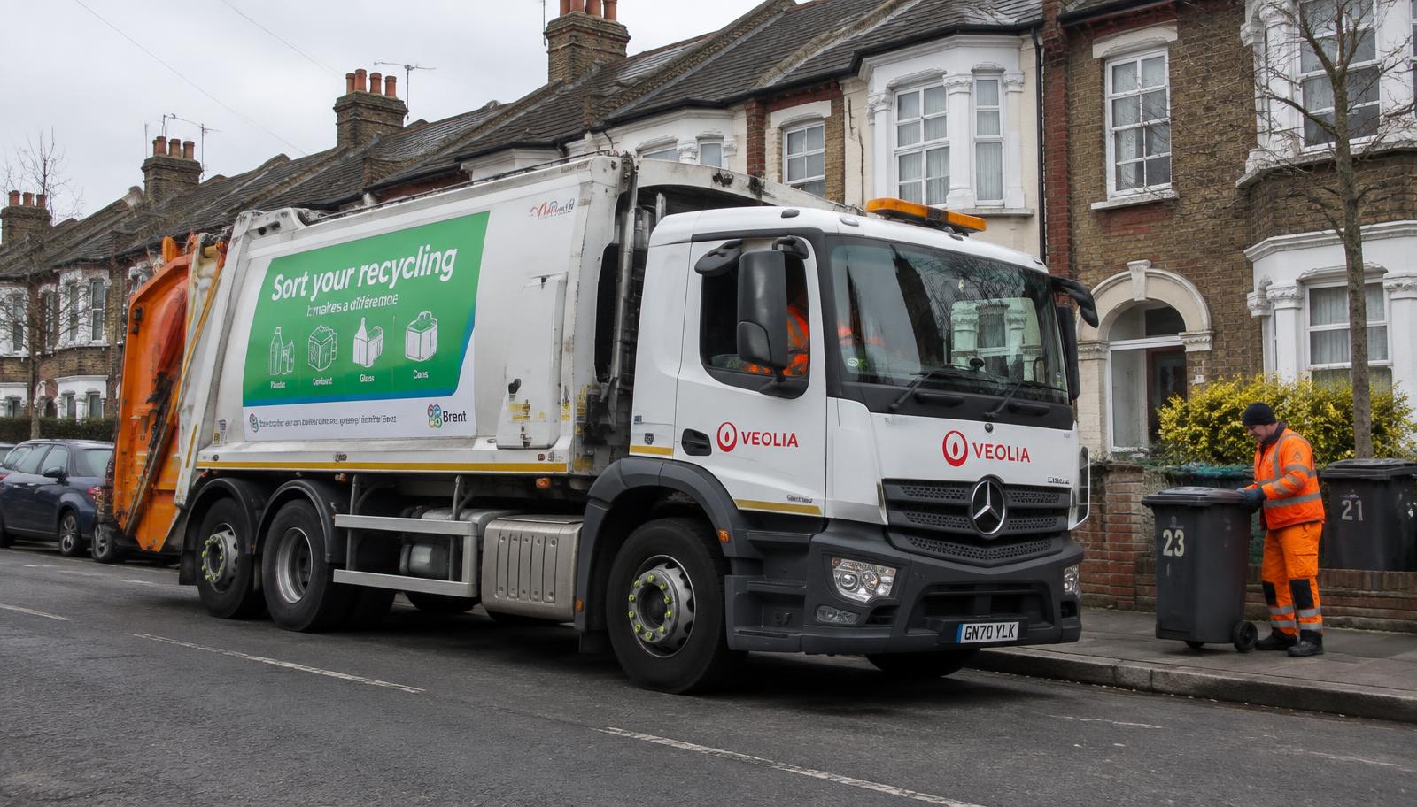 Waste collection truck on a residential street